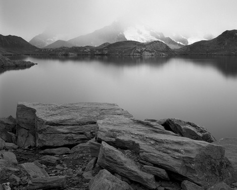 Photo 10. By removing details on the lake surface grace to a long exposure, the neutral density filter turned an ordinary greyish scenery into the emotional image that I sometimes call “Icy silence”