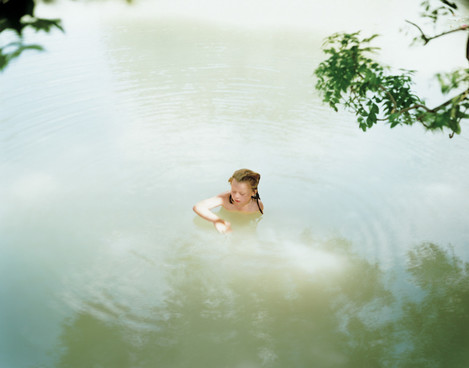 Image 7. Caption: The girl playing innocently in the lake has strong overtones of arcadian purity. Midday, Top Lake. Glyndebourne, East Sussex. Harry Cory Wright 