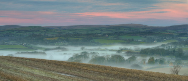 Cloud inversions at dawn below Blakemore Ridge, with Dartmoor beyond. The edge of night and day, the edge of manicured pastoral and rugged moorland.