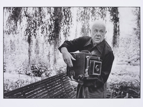 Martine Franck “Paul Strand photographing the Orgeval Garden” 1974. © Martine Franck/Magnum Photos