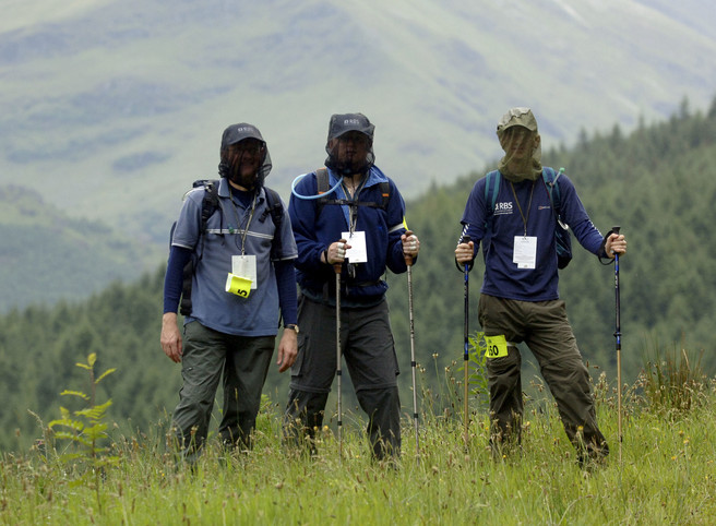 Walkers in the Scottish Highlands wearing Midge Nets to protect them from the infamous Scottish Midge
