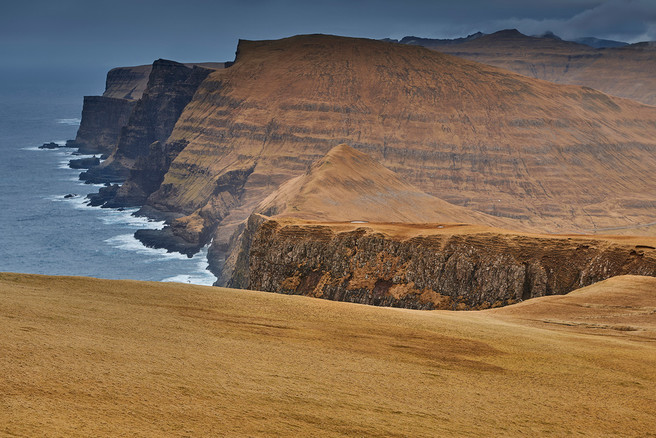 The huge west cliffs of the island of Suðuroy seen from Beinisvørð.
