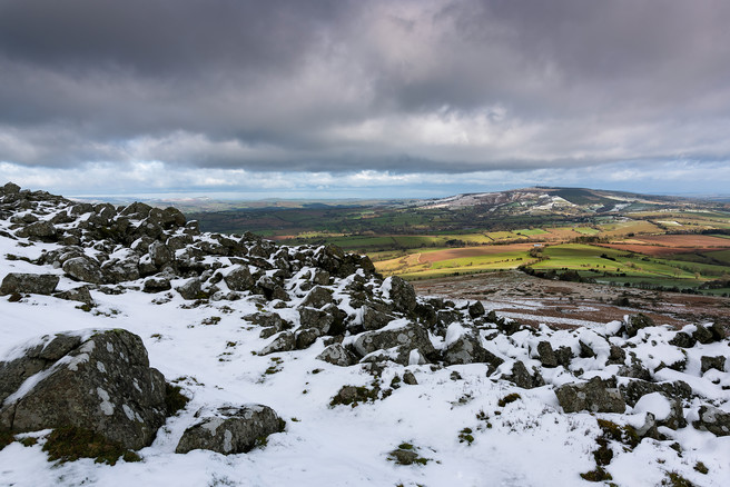 Kate Maxwell - Looking towards Brown Clee (Shropshire’s highest point) over the collapsed Bronze Age hillfort wall.