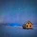Cold and alone: My initial intent was to produce an attractive image of the hut and the aurora, but in post processing I realised the single line of footsteps in the snow and the stars in the sky created story of being cold and alone.