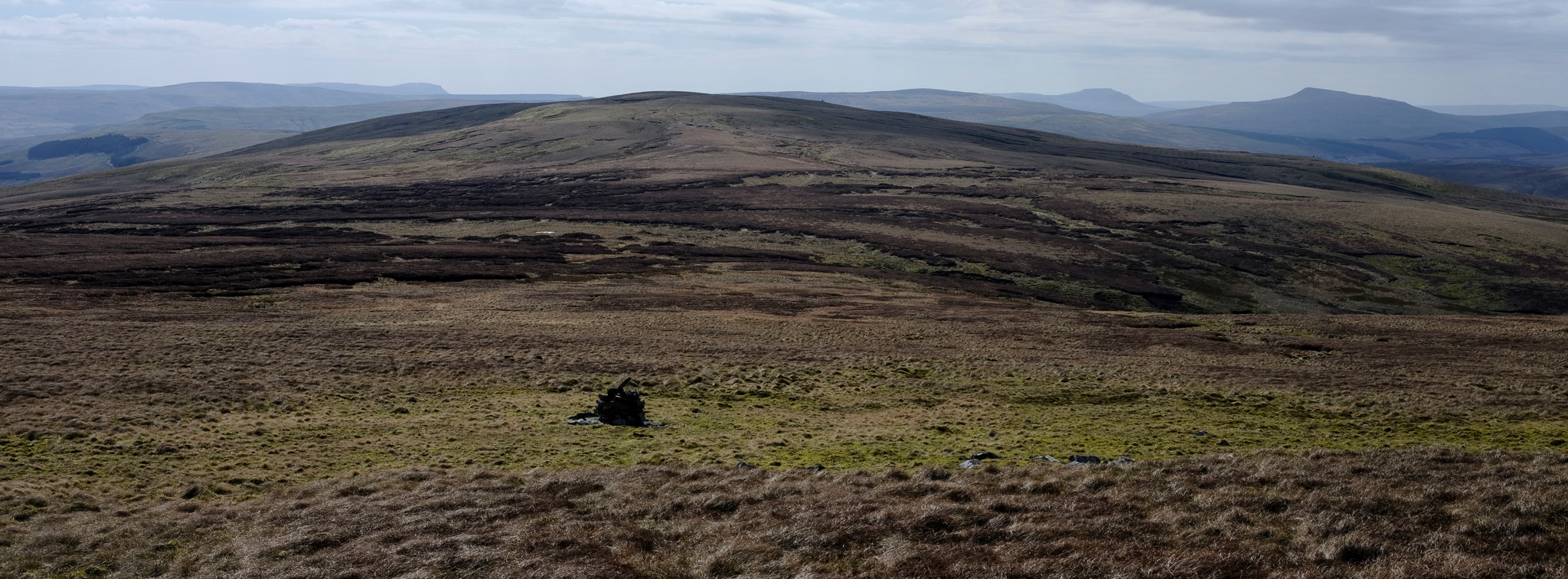Boundary Marker south of Hugh’s Seat looking towards Lunds Fell with Pen-y-ghent, Ingleborough and Whernside in the background